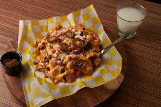 crispy nachos with melted cheese and toppings